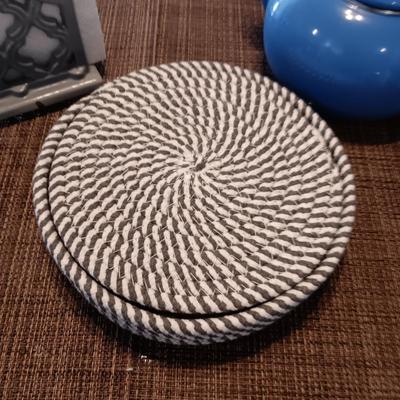 ENAMELED TEA KETTLE AND NAPKIN HOLDER PLUS 5 ROUND WOVEN TRIVETS