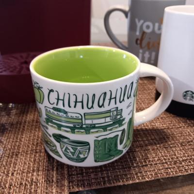 KEURIG COFFEE BREWER AND A COLLECTION OF STARBUCKS AND OTHER MUGS