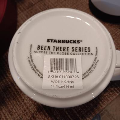 KEURIG COFFEE BREWER AND A COLLECTION OF STARBUCKS AND OTHER MUGS