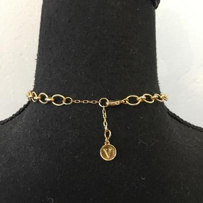 Vince Camuto Gold tone, tassel, white stone necklace, and emerald green rhinestone