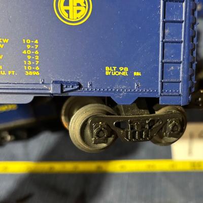 Lionel O Gauge Alaska Railroad model train cars and a diesel