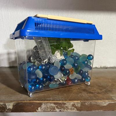 Sale Photo Thumbnail #358: Small fish tank for small gold fish is perfect for kids or beginners looking to get into aquatic pets.  Comes with rocks, fake plant, and a starfish centerpiece.