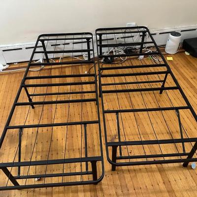 Sale Photo Thumbnail #143: Two folding bed frames that when combined, form a queen size bed frame.  Each one individually are a twin size.
