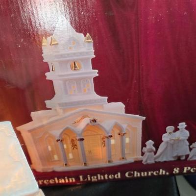 Porcelain Illuminated “Christmas Church & Caroler” 8-Piece Lighted Holiday Village Set – White & Gold Accents