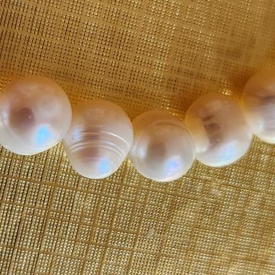 Sale Photo Thumbnail #97: This auction lot is for a Pearl Necklace. This necklace is made with cultured, hand-induced, natural pearls. This is a beautiful set of pearls - just perfect to accompany your little black dress.