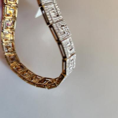 Sale Photo Thumbnail #103: This auction lot is for a Gold-Washed and Sterling Silver Bracelet.  This handsome bracelet has a backside of gold-wash and a front that sports a unique metalic design in sterling silver.  The bracelet is marked 925.  The bracelet is new and still has the