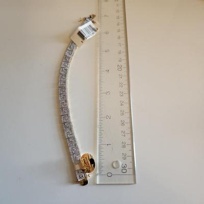 Sale Photo Thumbnail #107: This auction lot is for a Gold-Washed and Sterling Silver Bracelet.  This handsome bracelet has a backside of gold-wash and a front that sports a unique metalic design in sterling silver.  The bracelet is marked 925.  The bracelet is new and still has the