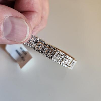 Sale Photo Thumbnail #104: This auction lot is for a Gold-Washed and Sterling Silver Bracelet.  This handsome bracelet has a backside of gold-wash and a front that sports a unique metalic design in sterling silver.  The bracelet is marked 925.  The bracelet is new and still has the