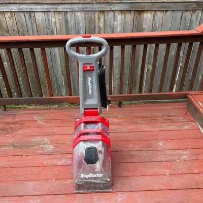 Sale Photo Thumbnail #160: The machine is a powerful, upright carpet cleaner designed for home use, providing professional-grade results by removing embedded dirt and grime.