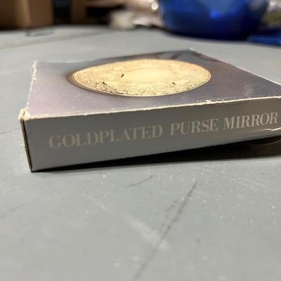 Sale Photo Thumbnail #203: Vintage Round Gold Tone Purse Pocket Mirror with Pouch & Box Leaf Pattern.

*shipping available at buyers expense