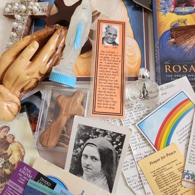 Sale Photo Thumbnail #136: This unique lot is chocked full of Religious Items.  Filled with icons, booklets, pamphlets, medals, scapulars, holy water containers, a plethora of crosses, many holy cards, prayer cards and themed bookmarks. Plus a nice set of praying hands carved from 