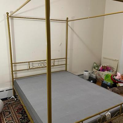 Sale Photo Thumbnail #105: This Queen size French Country Style Four Poster Metal Canopy Bed in Gold Finish showcases four posters for a stately, French country look in your bedroom. The clean-lined frame is crafted from stainless steel in a neutral finish, and it rests on round, 6