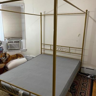 Sale Photo Thumbnail #104: This Queen size French Country Style Four Poster Metal Canopy Bed in Gold Finish showcases four posters for a stately, French country look in your bedroom. The clean-lined frame is crafted from stainless steel in a neutral finish, and it rests on round, 6