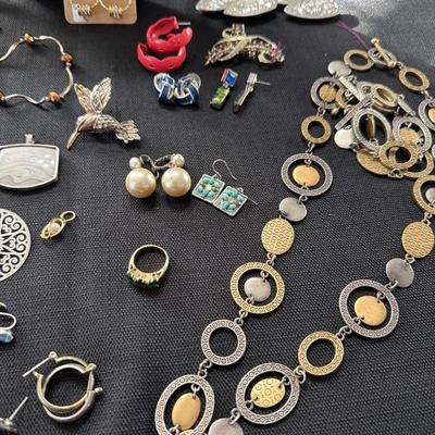 Sale Photo Thumbnail #121: Earrings, Necklaces, Pins, and more.