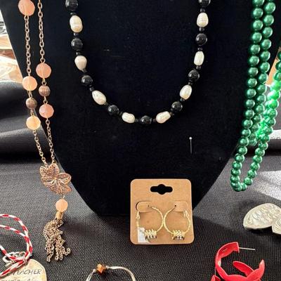 Sale Photo Thumbnail #118: Earrings, Necklaces, Pins, and more.