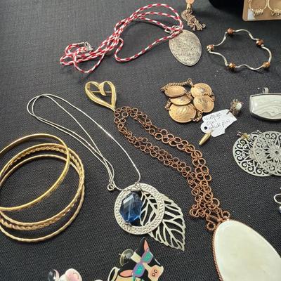 Sale Photo Thumbnail #120: Earrings, Necklaces, Pins, and more.