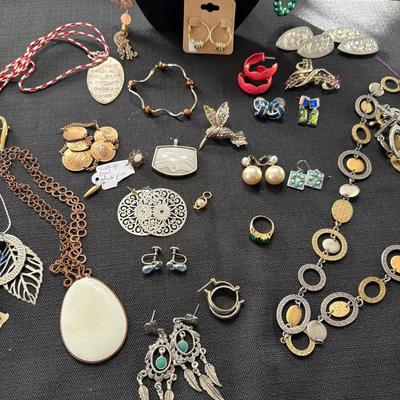 Sale Photo Thumbnail #117: Earrings, Necklaces, Pins, and more.
