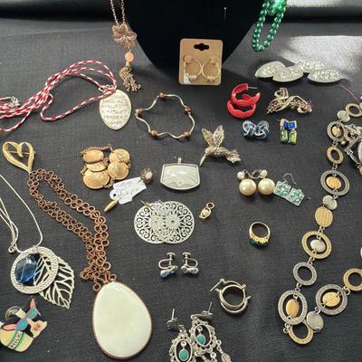 Sale Photo Thumbnail #119: Earrings, Necklaces, Pins, and more.