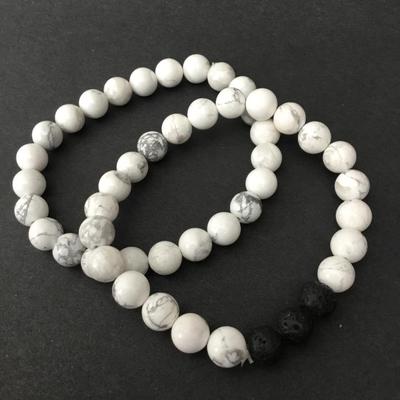 Two pairs of white stone bead, volcanic bead bracelets