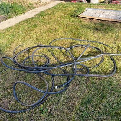 Sale Photo Thumbnail #382: Two garden hoses with no leaks on the connections on either end of the hose.