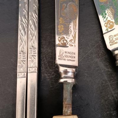 LOT 26: Handmade Bamboo Trays, Wingen Solingen Collectible Turkey Knives, Ceramic Studio Figurine & More