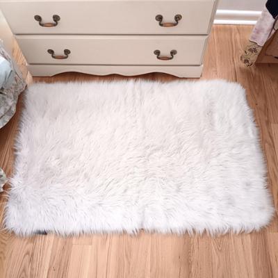 LOT 52: Faux Fur Rug, Back Rest & Stool along with Books