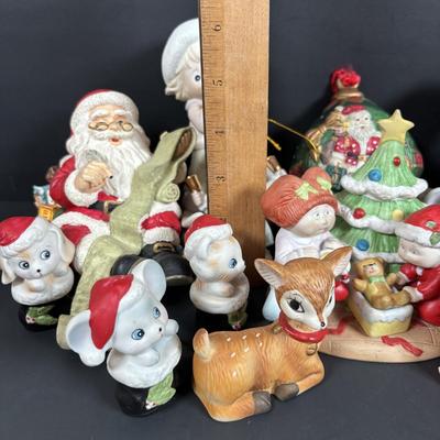 LOT 127: Holiday Figurines Collection: 1984 Cabbage Patch, Precious Moments, Santa Stocking Holders, Enesco & More