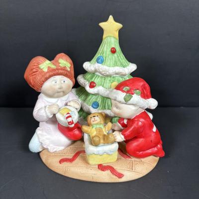 LOT 127: Holiday Figurines Collection: 1984 Cabbage Patch, Precious Moments, Santa Stocking Holders, Enesco & More