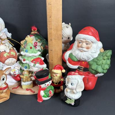 LOT 127: Holiday Figurines Collection: 1984 Cabbage Patch, Precious Moments, Santa Stocking Holders, Enesco & More