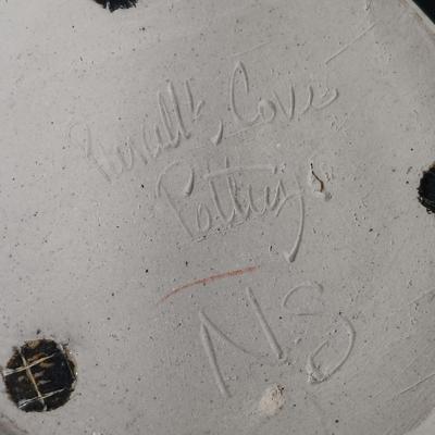 LOT 161: Nautical-Themed Signed Art Pottery with Metal Wall Display