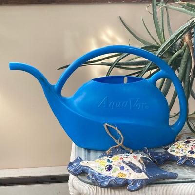 LOT 199: Wicker Accent / Patio Table with Live Aloe Plant, Pottery Fish and More