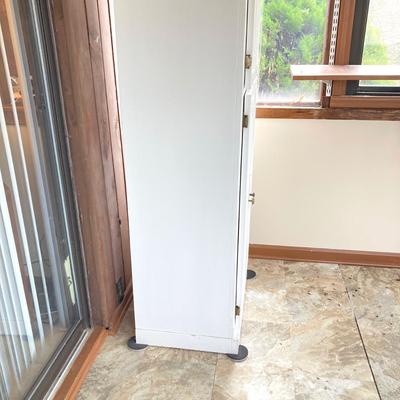 LOT 203: Tall White Storage Cabinet