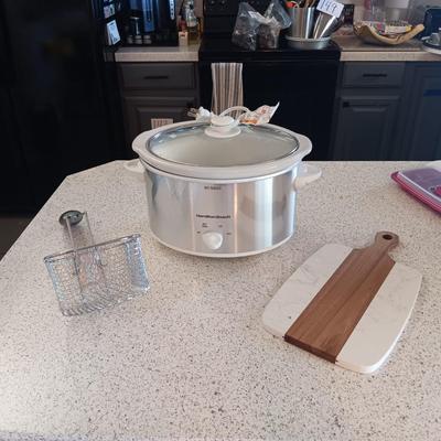 CROCK POT, FRYING BASKET AND A WOOD AND MARBLE CUTTING BOARD