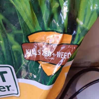 NEW BAG OF WEED AND FEED & A WEED SPRAYER