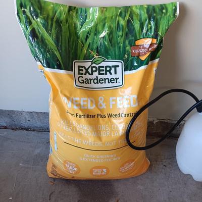 NEW BAG OF WEED AND FEED & A WEED SPRAYER