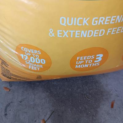 NEW BAG OF WEED AND FEED & A WEED SPRAYER