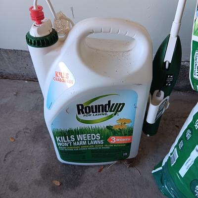 NEW BAG OF LAWN FERTILIZER AND MOSTLY FULL ROUNDUP WEED KILLER