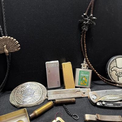Sale Photo Thumbnail #193: Lighters, Money Clip, Pocket Knives, Bolos Belt buckles