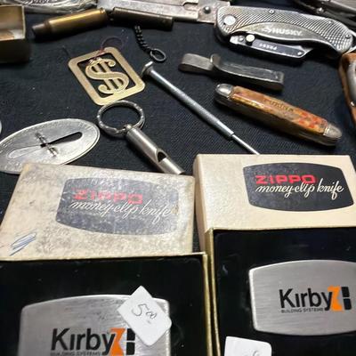 Sale Photo Thumbnail #191: Lighters, Money Clip, Pocket Knives, Bolos Belt buckles