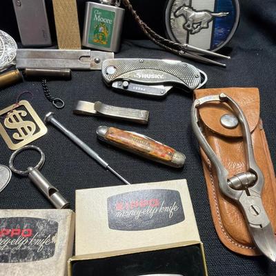 Sale Photo Thumbnail #190: Lighters, Money Clip, Pocket Knives, Bolos Belt buckles