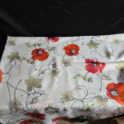 Two amber glass cake pans Fire King - Pyrex and two brand new metal bread loaf pans with a poppy flower tablecloth