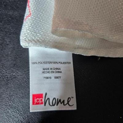 Two amber glass cake pans Fire King - Pyrex and two brand new metal bread loaf pans with a poppy flower tablecloth