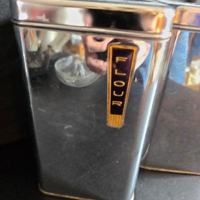 Kitchen items with a retro kitchen flare - Chrome canisters - Glass juicer - aluminum bakeware - Water dippers and more