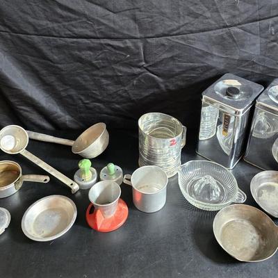 Kitchen items with a retro kitchen flare - Chrome canisters - Glass juicer - aluminum bakeware - Water dippers and more