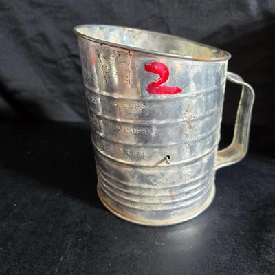 Kitchen items with a retro kitchen flare - Chrome canisters - Glass juicer - aluminum bakeware - Water dippers and more