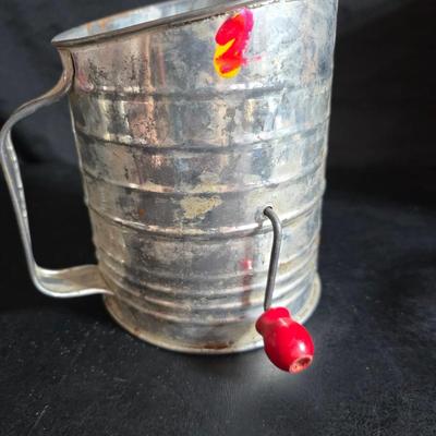 Kitchen items with a retro kitchen flare - Chrome canisters - Glass juicer - aluminum bakeware - Water dippers and more