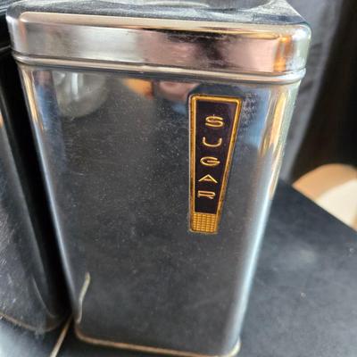 Kitchen items with a retro kitchen flare - Chrome canisters - Glass juicer - aluminum bakeware - Water dippers and more