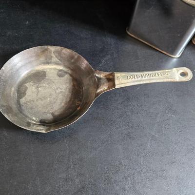 Kitchen items with a retro kitchen flare - Chrome canisters - Glass juicer - aluminum bakeware - Water dippers and more