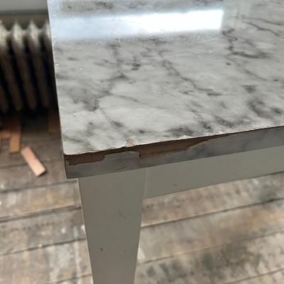 Sale Photo Thumbnail #387: Table has a top that is wrapped to look like granite.  The wrap is pealing along the edges and the table top has some chips in it.