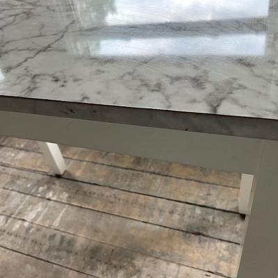 Sale Photo Thumbnail #388: Table has a top that is wrapped to look like granite.  The wrap is pealing along the edges and the table top has some chips in it.